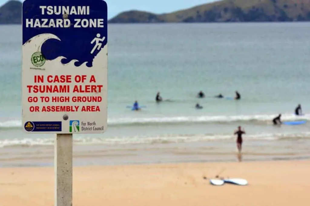 Tsunami hazard zone danger sign on a beach
